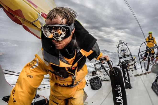 Onboard Abu Dhabi Ocean Racing - Luke Parko Parkinson adjusts the daggerboard in the pit wearing goggles to protect his eyes from the blinding spray - Leg five to Itajai -  Volvo Ocean Race 2015 © Matt Knighton/Abu Dhabi Ocean Racing